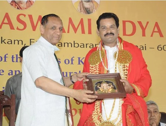 Receiving a felicitation on stage