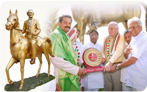 Award presentation beside a horse statue