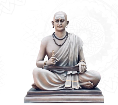 Traditional sculpture of a seated sage holding a stringed instrument