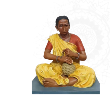 Sculpture of a tribal artisan seated at work